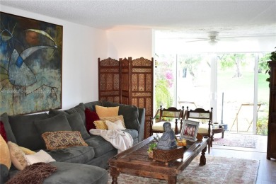 Large 1st Floor corner unit.  Privateplete impact glass on Sunrise Lakes Phase III in Florida - for sale on GolfHomes.com, golf home, golf lot