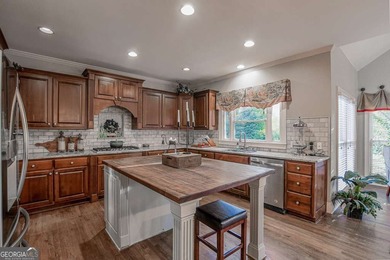 Experience refined living at 1041 Windermere Crossing an elegant on Windermere Golf Club in Georgia - for sale on GolfHomes.com, golf home, golf lot