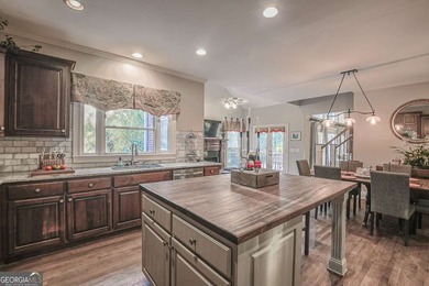 Experience refined living at 1041 Windermere Crossing an elegant on Windermere Golf Club in Georgia - for sale on GolfHomes.com, golf home, golf lot