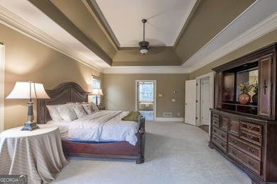 Experience refined living at 1041 Windermere Crossing an elegant on Windermere Golf Club in Georgia - for sale on GolfHomes.com, golf home, golf lot