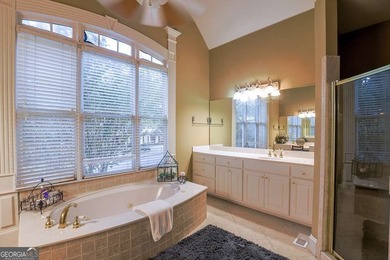 Experience refined living at 1041 Windermere Crossing an elegant on Windermere Golf Club in Georgia - for sale on GolfHomes.com, golf home, golf lot