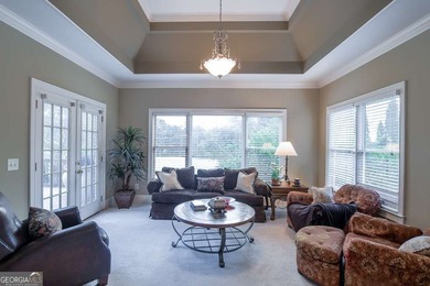 Experience refined living at 1041 Windermere Crossing an elegant on Windermere Golf Club in Georgia - for sale on GolfHomes.com, golf home, golf lot
