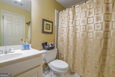 Experience refined living at 1041 Windermere Crossing an elegant on Windermere Golf Club in Georgia - for sale on GolfHomes.com, golf home, golf lot