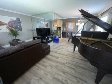 FURNISHED TURNKEY WITH A MASON & HAMLIN GRAND PIANO  in the on Kings Point Golf -Flanders Way in Florida - for sale on GolfHomes.com, golf home, golf lot