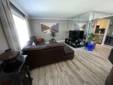 FURNISHED TURNKEY WITH A MASON & HAMLIN GRAND PIANO  in the on Kings Point Golf -Flanders Way in Florida - for sale on GolfHomes.com, golf home, golf lot