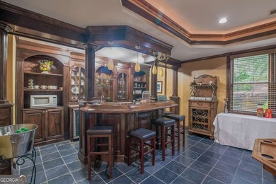 Experience refined living at 1041 Windermere Crossing an elegant on Windermere Golf Club in Georgia - for sale on GolfHomes.com, golf home, golf lot