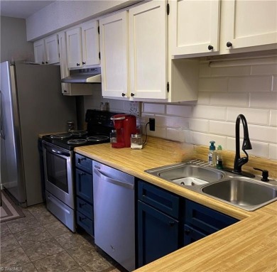 Discover this charming 2 bedroom, one and a half bathroom condo on Heather Hills Golf Course in North Carolina - for sale on GolfHomes.com, golf home, golf lot