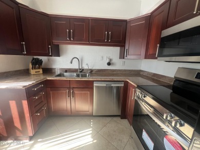 This spacious upper level condo gets tons of light, has a new on Arizona Biltmore Golf and Country Club in Arizona - for sale on GolfHomes.com, golf home, golf lot