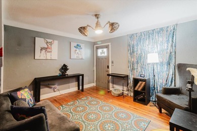 Tucked beneath the shade of mature trees in the beloved Edgemoor on Mangrove Bay Golf Course in Florida - for sale on GolfHomes.com, golf home, golf lot