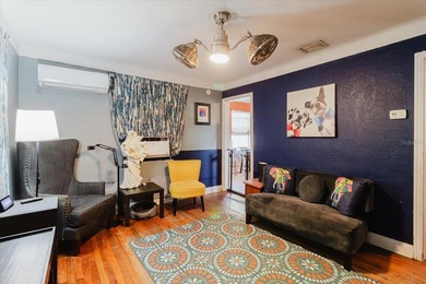 Tucked beneath the shade of mature trees in the beloved Edgemoor on Mangrove Bay Golf Course in Florida - for sale on GolfHomes.com, golf home, golf lot