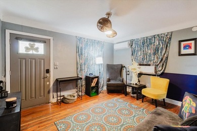 Tucked beneath the shade of mature trees in the beloved Edgemoor on Mangrove Bay Golf Course in Florida - for sale on GolfHomes.com, golf home, golf lot