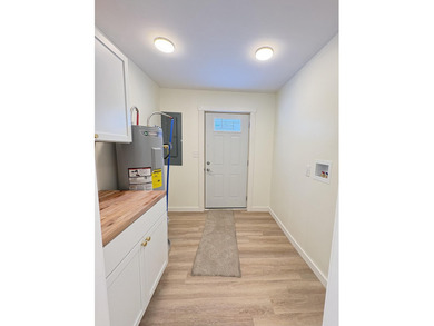 This charming Lakes of the North home has been fully renovated on Lakes of the North Deer Run Golf Course in Michigan - for sale on GolfHomes.com, golf home, golf lot