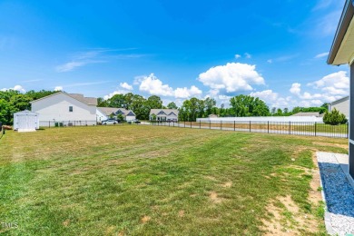 Are you looking for a newer construction home on almost half an on Reedy Creek Golf Course in North Carolina - for sale on GolfHomes.com, golf home, golf lot