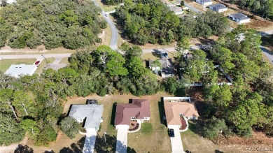 Quality built 3 BR, 2 Bath with a split floor plan, screen porch on Citrus Springs Country Club in Florida - for sale on GolfHomes.com, golf home, golf lot