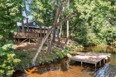 LAKEFRONT COTTAGE IN THE PINES – SPRING CREEK COUNTRY CLUB! on Spring Creek Country Club in Texas - for sale on GolfHomes.com, golf home, golf lot