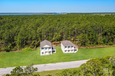 BUILDER WILL INCLUDE REFRIGERATOR AND BLINDS FOR ANY BUYER WHO on The Golf Club of the Wharf in Alabama - for sale on GolfHomes.com, golf home, golf lot