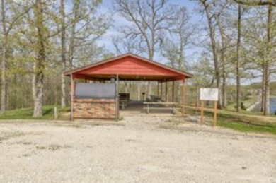 Build your dream home to suit your needs on this beautiul lot on Raintree Country Club in Missouri - for sale on GolfHomes.com, golf home, golf lot