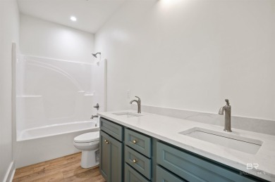 BUILDER WILL INCLUDE REFRIGERATOR AND BLINDS FOR ANY BUYER WHO on The Golf Club of the Wharf in Alabama - for sale on GolfHomes.com, golf home, golf lot