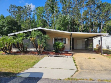 This home is on leased land in Cypress Lakes Village (a 55+ on Big Cypress Golf and Country Club in Florida - for sale on GolfHomes.com, golf home, golf lot