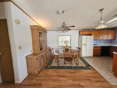 This home is on leased land in Cypress Lakes Village (a 55+ on Big Cypress Golf and Country Club in Florida - for sale on GolfHomes.com, golf home, golf lot