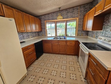 This home is on leased land in Cypress Lakes Village (a 55+ on Big Cypress Golf and Country Club in Florida - for sale on GolfHomes.com, golf home, golf lot