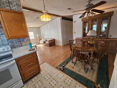 This home is on leased land in Cypress Lakes Village (a 55+ on Big Cypress Golf and Country Club in Florida - for sale on GolfHomes.com, golf home, golf lot