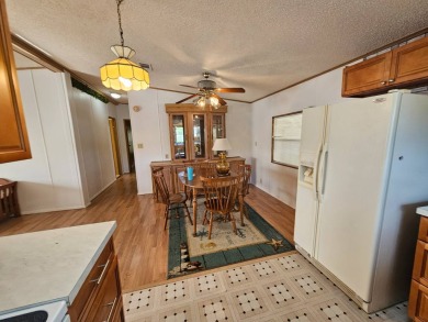 This home is on leased land in Cypress Lakes Village (a 55+ on Big Cypress Golf and Country Club in Florida - for sale on GolfHomes.com, golf home, golf lot