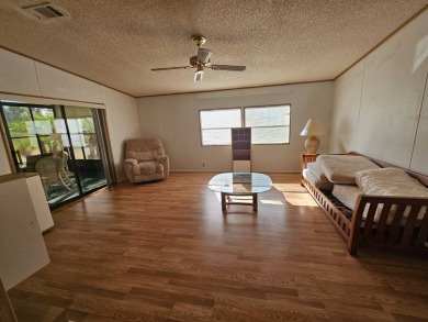 This home is on leased land in Cypress Lakes Village (a 55+ on Big Cypress Golf and Country Club in Florida - for sale on GolfHomes.com, golf home, golf lot