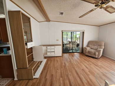 This home is on leased land in Cypress Lakes Village (a 55+ on Big Cypress Golf and Country Club in Florida - for sale on GolfHomes.com, golf home, golf lot