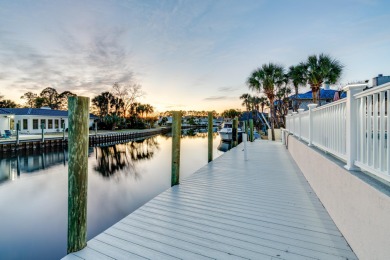 Tucked behind the private gates of the Bay Point community, this on Bay Point Resort Golf Club in Florida - for sale on GolfHomes.com, golf home, golf lot