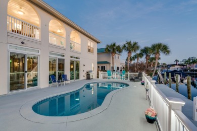 Tucked behind the private gates of the Bay Point community, this on Bay Point Resort Golf Club in Florida - for sale on GolfHomes.com, golf home, golf lot