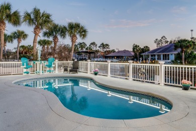 Tucked behind the private gates of the Bay Point community, this on Bay Point Resort Golf Club in Florida - for sale on GolfHomes.com, golf home, golf lot