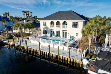 Tucked behind the private gates of the Bay Point community, this on Bay Point Resort Golf Club in Florida - for sale on GolfHomes.com, golf home, golf lot