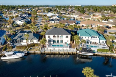 Tucked behind the private gates of the Bay Point community, this on Bay Point Resort Golf Club in Florida - for sale on GolfHomes.com, golf home, golf lot