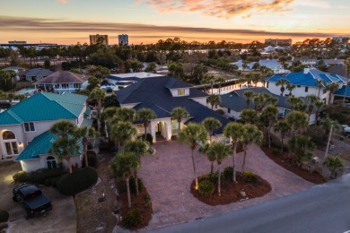 Tucked behind the private gates of the Bay Point community, this on Bay Point Resort Golf Club in Florida - for sale on GolfHomes.com, golf home, golf lot