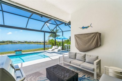 Timeless 2022-built pool home that overlooks the tranquil lake on Bent Pine Golf Club in Florida - for sale on GolfHomes.com, golf home, golf lot