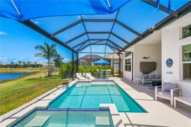 Timeless 2022-built pool home that overlooks the tranquil lake on Bent Pine Golf Club in Florida - for sale on GolfHomes.com, golf home, golf lot