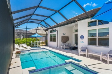 Timeless 2022-built pool home that overlooks the tranquil lake on Bent Pine Golf Club in Florida - for sale on GolfHomes.com, golf home, golf lot