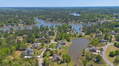 THIS GORGEOUS NEW CONSTRUCTION IS DIRECTLY ON OSPREY POINTE POND on Harbor Club Golf and Country Club in Georgia - for sale on GolfHomes.com, golf home, golf lot