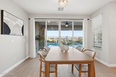 Situated on Hole 14, this beautifully upgraded home showcases on Verrado Golf Club - Victory in Arizona - for sale on GolfHomes.com, golf home, golf lot