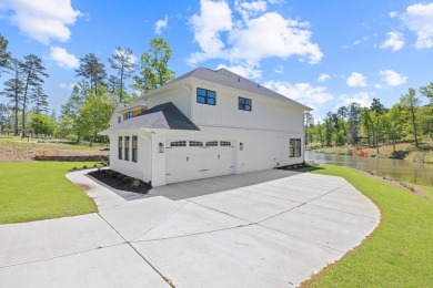 THIS GORGEOUS NEW CONSTRUCTION IS DIRECTLY ON OSPREY POINTE POND on Harbor Club Golf and Country Club in Georgia - for sale on GolfHomes.com, golf home, golf lot