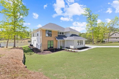 THIS GORGEOUS NEW CONSTRUCTION IS DIRECTLY ON OSPREY POINTE POND on Harbor Club Golf and Country Club in Georgia - for sale on GolfHomes.com, golf home, golf lot
