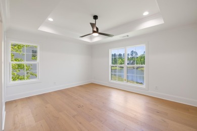 THIS GORGEOUS NEW CONSTRUCTION IS DIRECTLY ON OSPREY POINTE POND on Harbor Club Golf and Country Club in Georgia - for sale on GolfHomes.com, golf home, golf lot