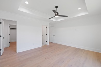 THIS GORGEOUS NEW CONSTRUCTION IS DIRECTLY ON OSPREY POINTE POND on Harbor Club Golf and Country Club in Georgia - for sale on GolfHomes.com, golf home, golf lot