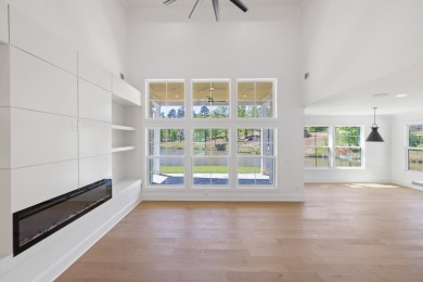 THIS GORGEOUS NEW CONSTRUCTION IS DIRECTLY ON OSPREY POINTE POND on Harbor Club Golf and Country Club in Georgia - for sale on GolfHomes.com, golf home, golf lot