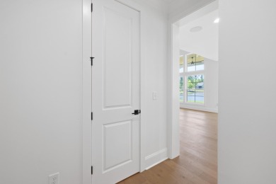 THIS GORGEOUS NEW CONSTRUCTION IS DIRECTLY ON OSPREY POINTE POND on Harbor Club Golf and Country Club in Georgia - for sale on GolfHomes.com, golf home, golf lot