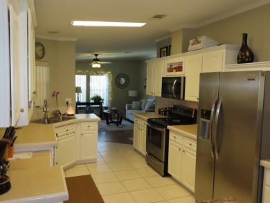 his great home is located on an oversized corner lot. The 18 x on Crane Lakes Golf and Country Club in Florida - for sale on GolfHomes.com, golf home, golf lot