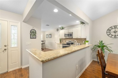 Welcome to this beautifully enhanced Wisteria model, where on Glenview Championship Golf and Country Club in Florida - for sale on GolfHomes.com, golf home, golf lot
