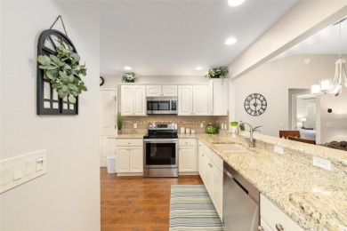 Welcome to this beautifully enhanced Wisteria model, where on Glenview Championship Golf and Country Club in Florida - for sale on GolfHomes.com, golf home, golf lot