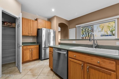 This spacious 2,013 sf home has 3 BR, 2 BA, kitchen, living rm on Estrella Mountain Ranch Golf Course in Arizona - for sale on GolfHomes.com, golf home, golf lot